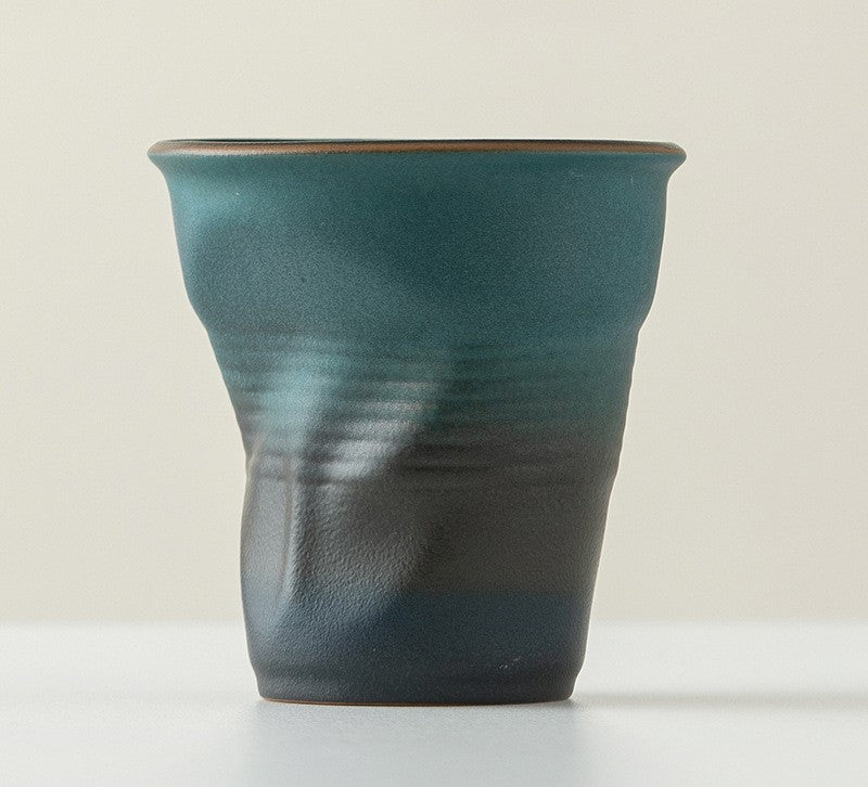 Folded Echo – Handcrafted Ceramic Coffee Cup with Origami Texture