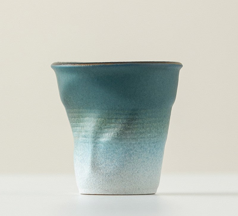 Folded Echo – Handcrafted Ceramic Coffee Cup with Origami Texture