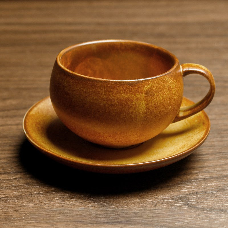 Amber Nest – Handcrafted Egg-Shaped Ceramic Coffee Cup with Saucer
