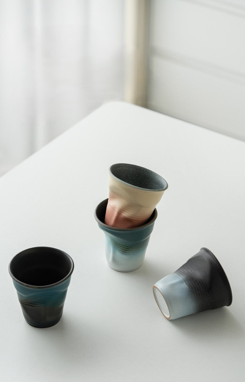 Folded Echo – Handcrafted Ceramic Coffee Cup with Origami Texture