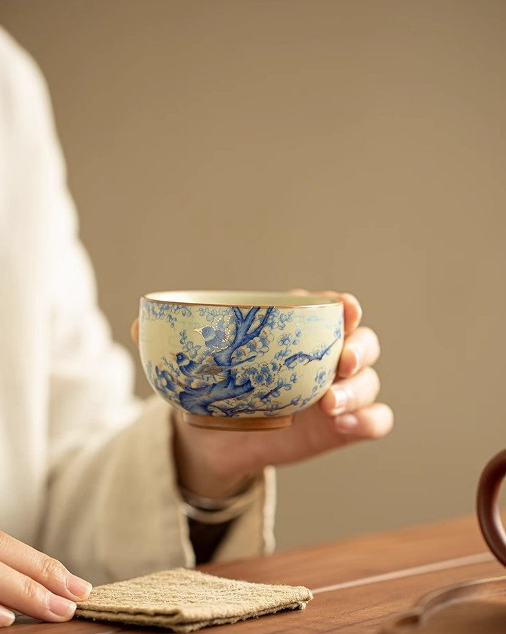 Joy Rising – Handcrafted Porcelain Tea Cup with Magpie & Plum Motif