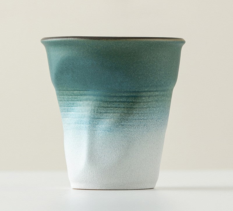 Folded Echo – Handcrafted Ceramic Coffee Cup with Origami Texture