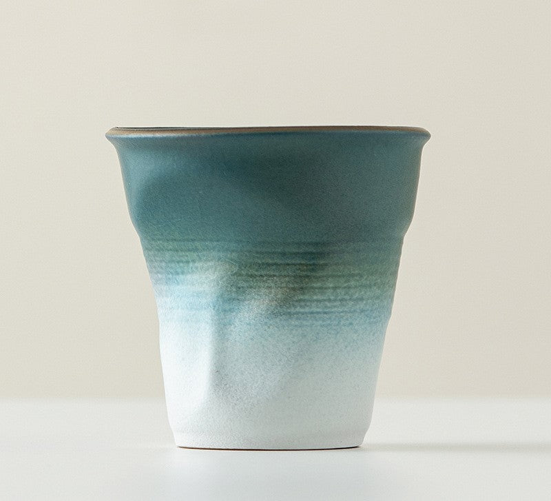 Folded Echo – Handcrafted Ceramic Coffee Cup with Origami Texture