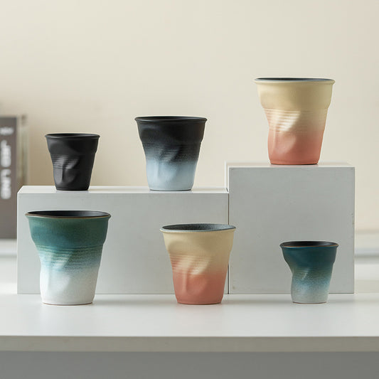 Folded Echo – Handcrafted Ceramic Coffee Cup with Origami Texture