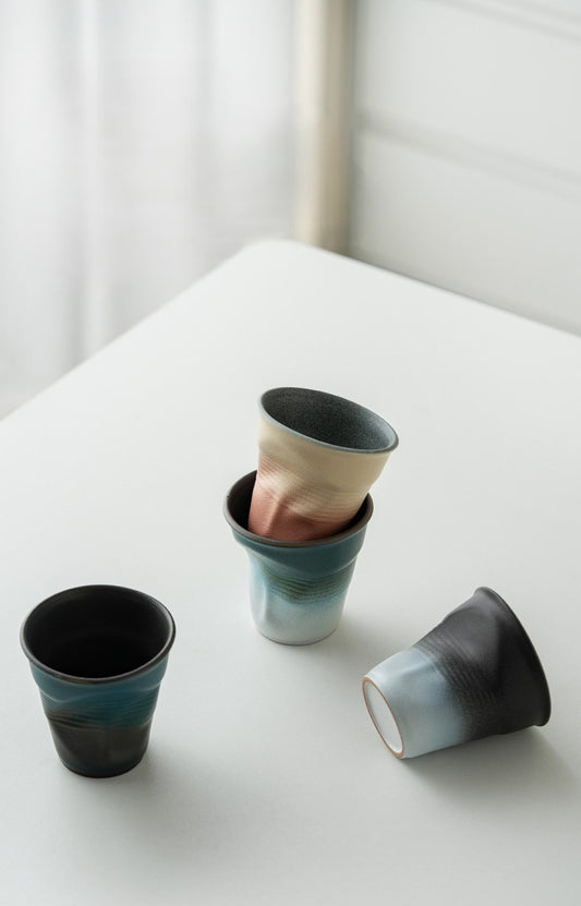 Folded Echo – Handcrafted Ceramic Coffee Cup with Origami Texture